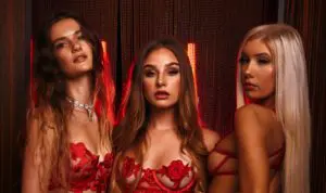 Models in red lingerie with dramatic lighting